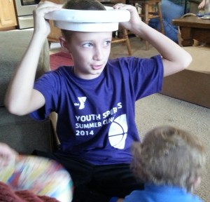 Jameson, in a toddler toilet seat crown--at Uncle Jade's birthday party.